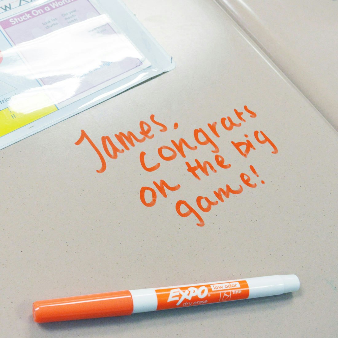 congrats-message-written-on-desk-in-orange-fine-expo.jpg