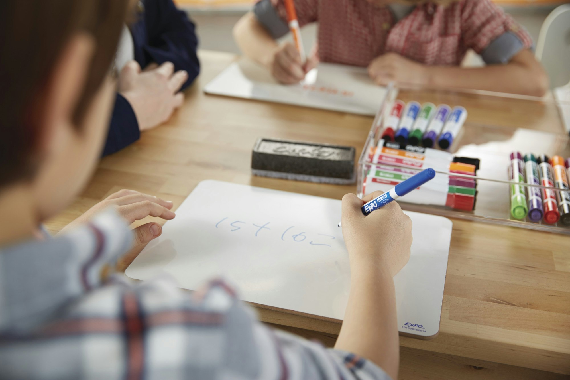 student-working-on-individual-whiteboard-with-expo-2in1-marker.jpg