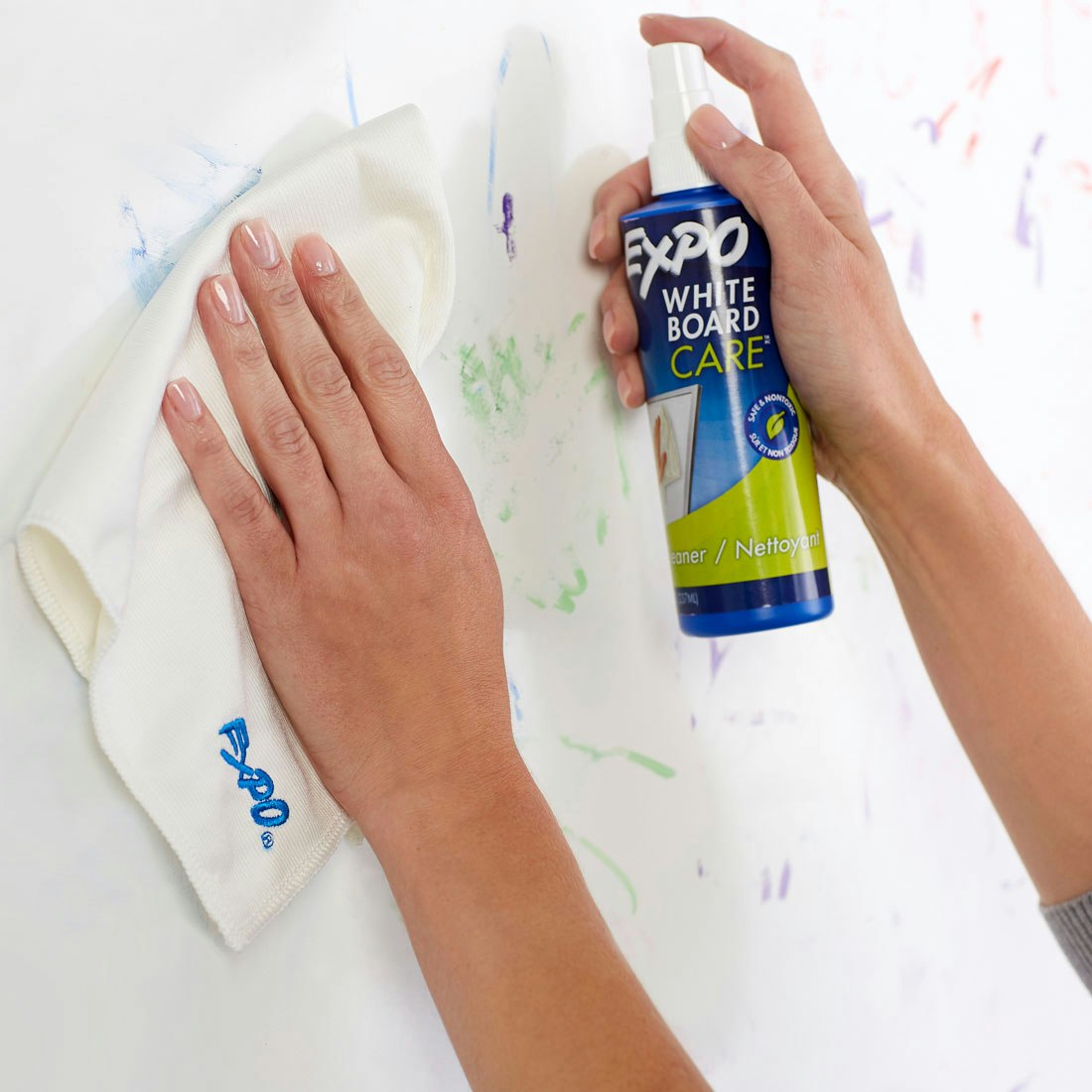 using-spray-and-cloth-on-whiteboard-to-remove-marker.jpg