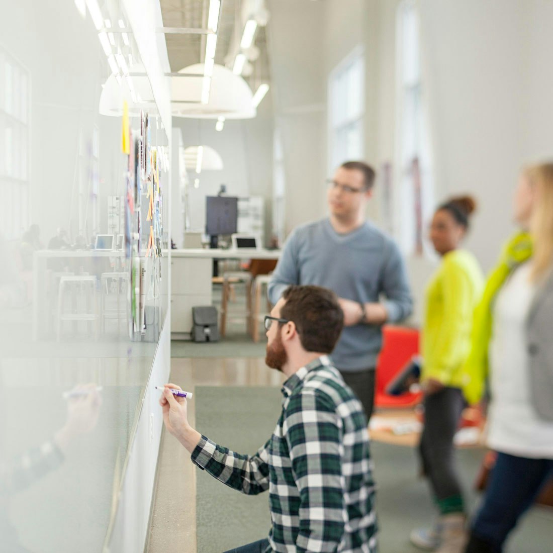 group-working-collaboratively-on-whiteboard.jpg