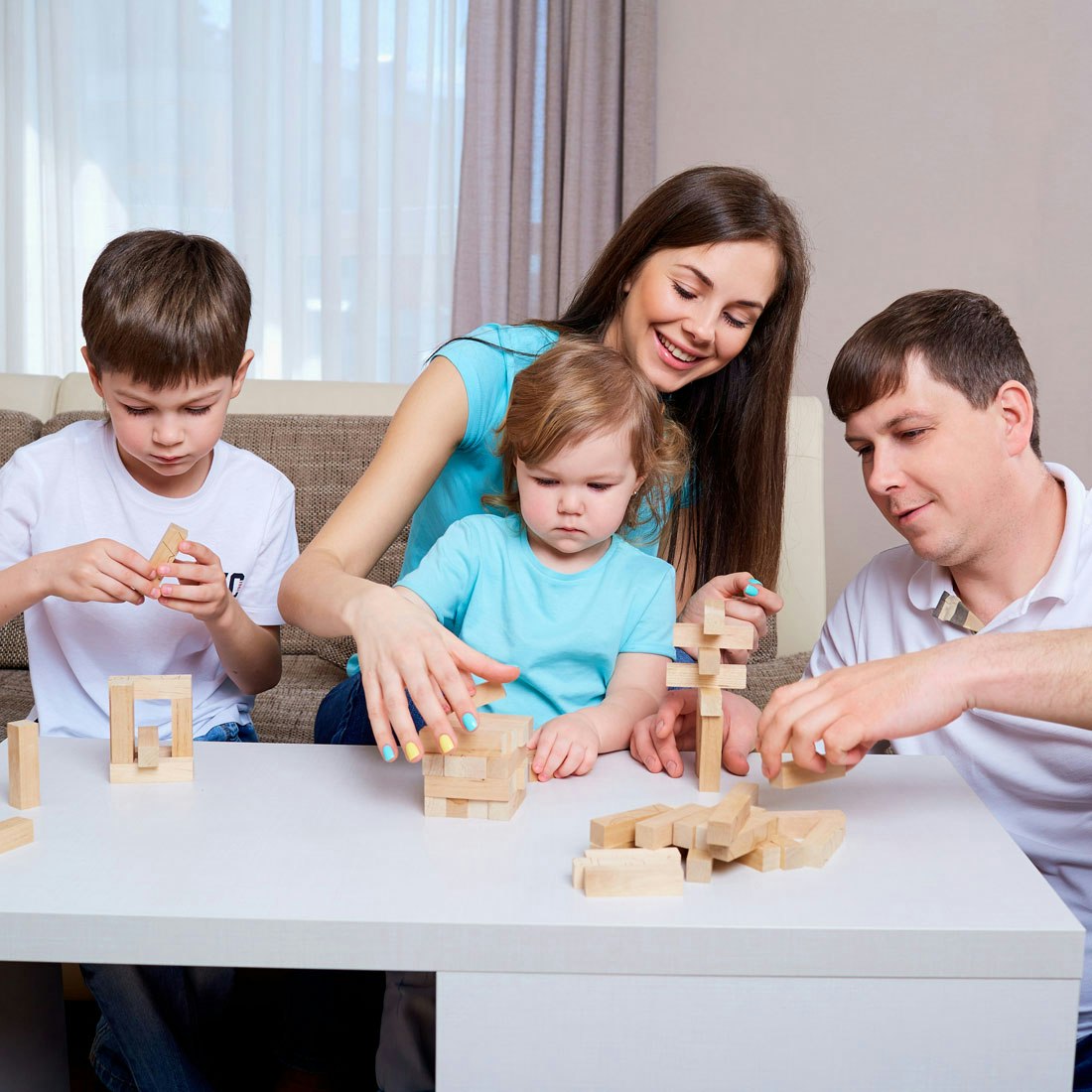 family-playing-building-with-blocks-on-table.jpg